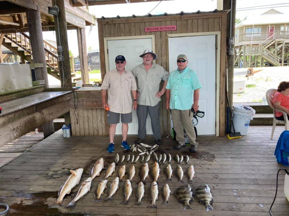 Trio of anglers enjoying a fishing trip in Saint Bernard