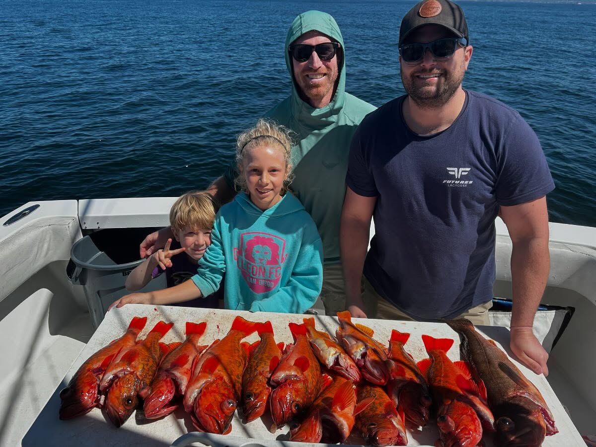 Four people enjoying a fishing trip in San Diego