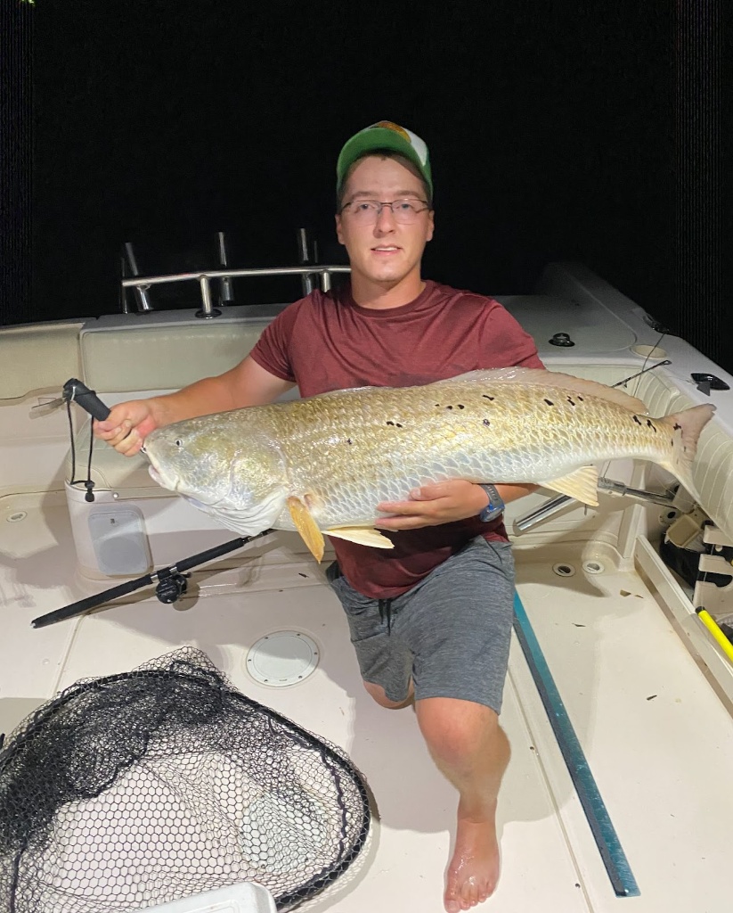 A lone fisherman reeling in a 29-inch catch in VA
