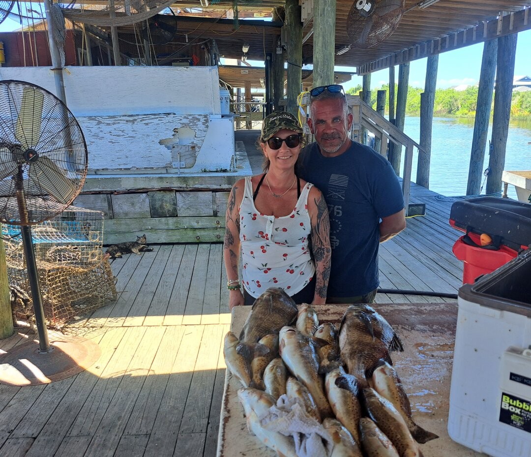 Fresh caught fish displayed on cleaning table at New Orleans fishing dock
