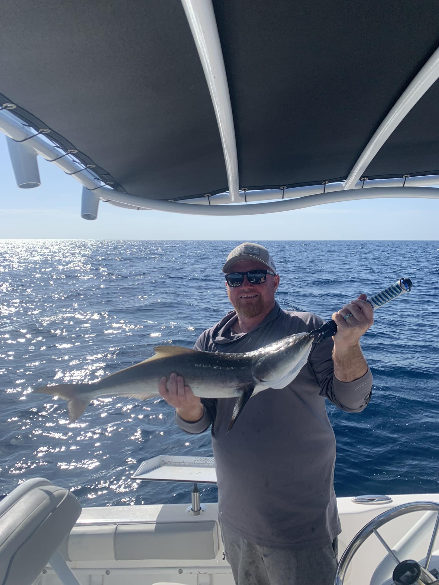 A lone angler reeling in a big catch in Florida