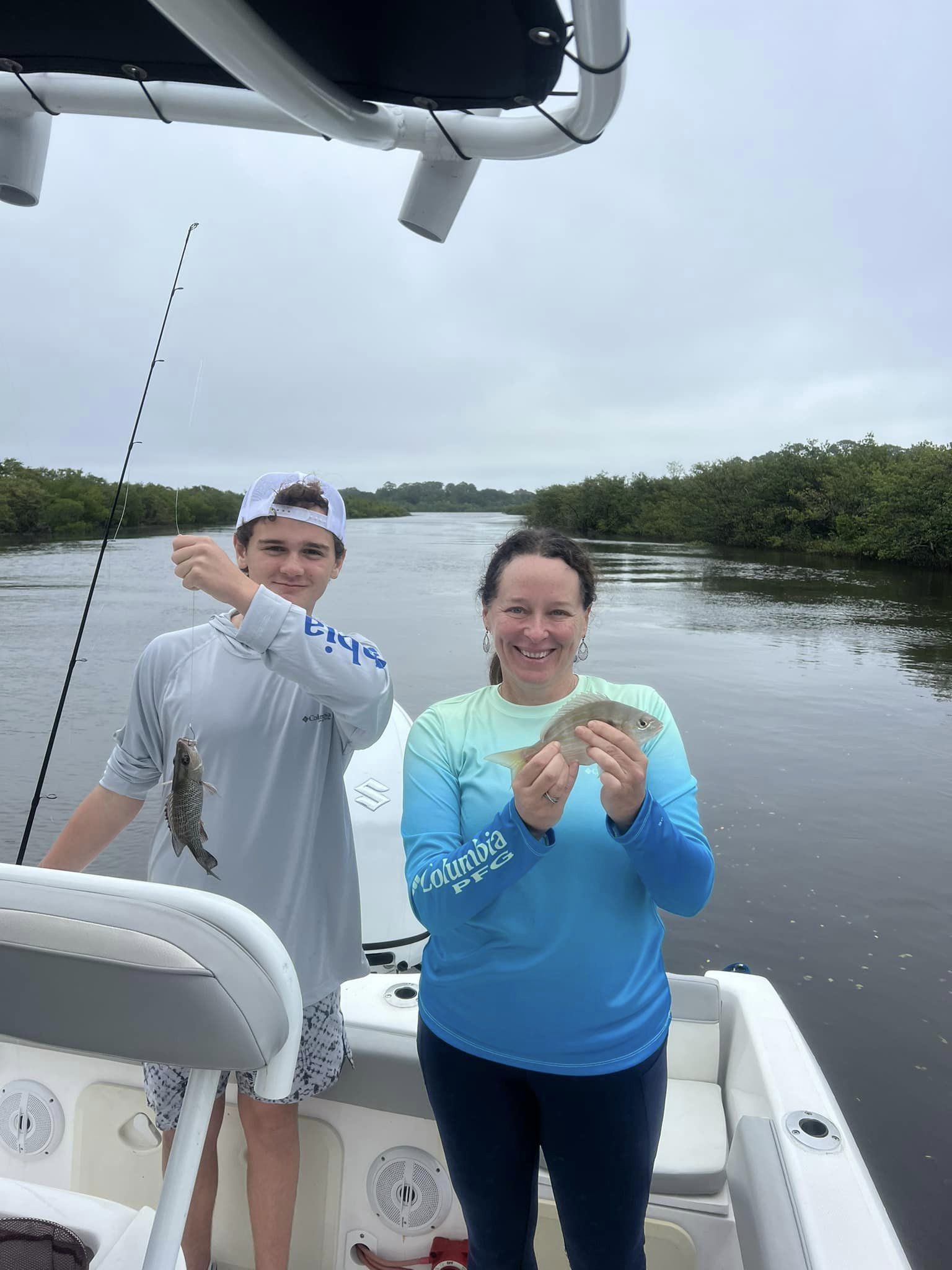 Two grey snapper fish caught by two people in Port Orange