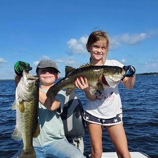 Two people fishing with poles in Florida