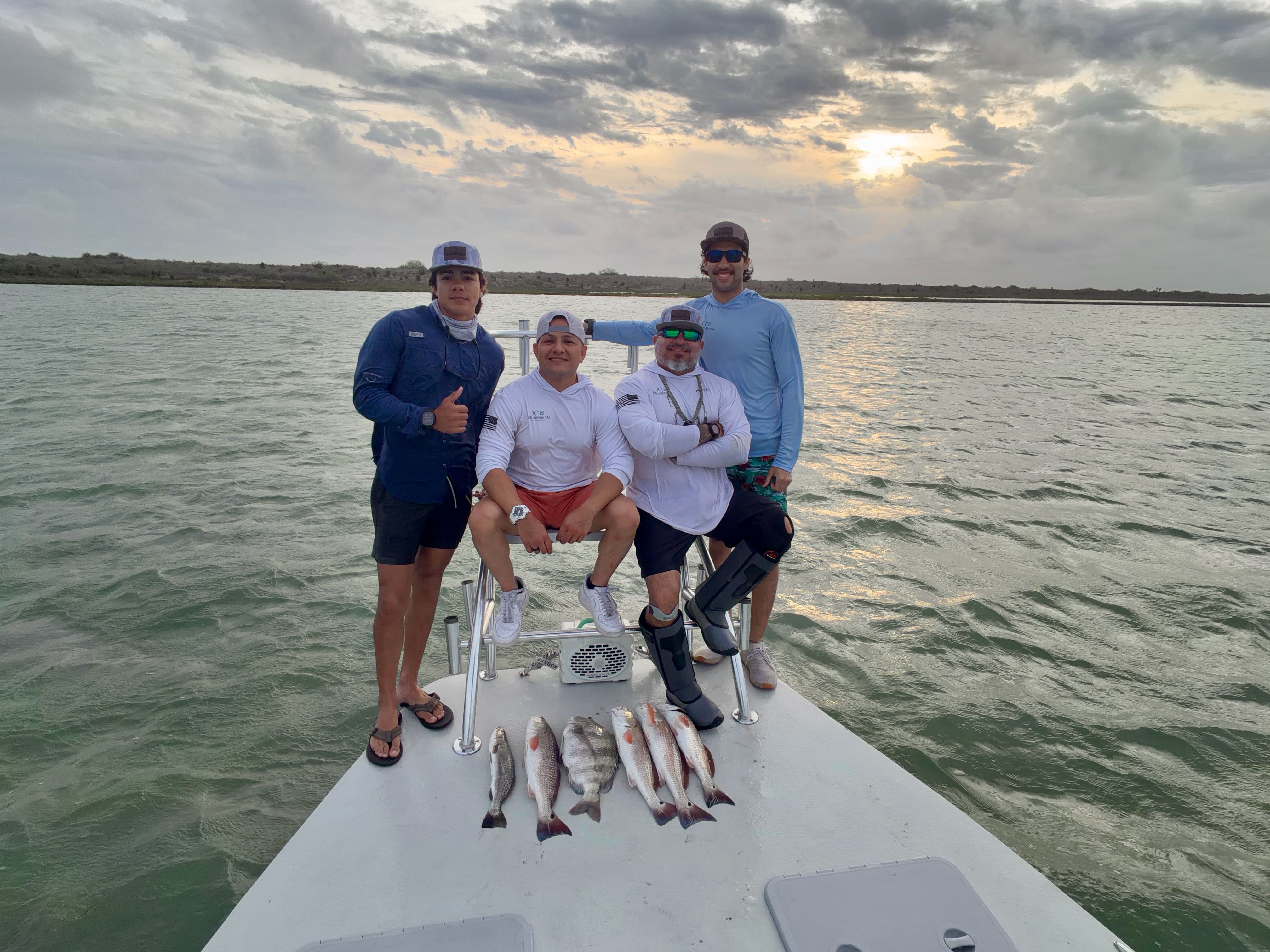 Fishing boat with fresh caught redfish and sheepshead displayed on deck in Brownsville TX waters