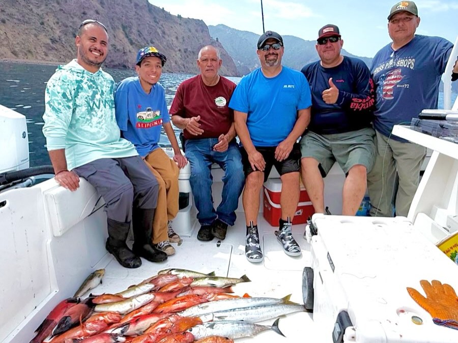 San Pedro fishing charter boat with anglers bottom fishing for rockfish and bass near kelp beds