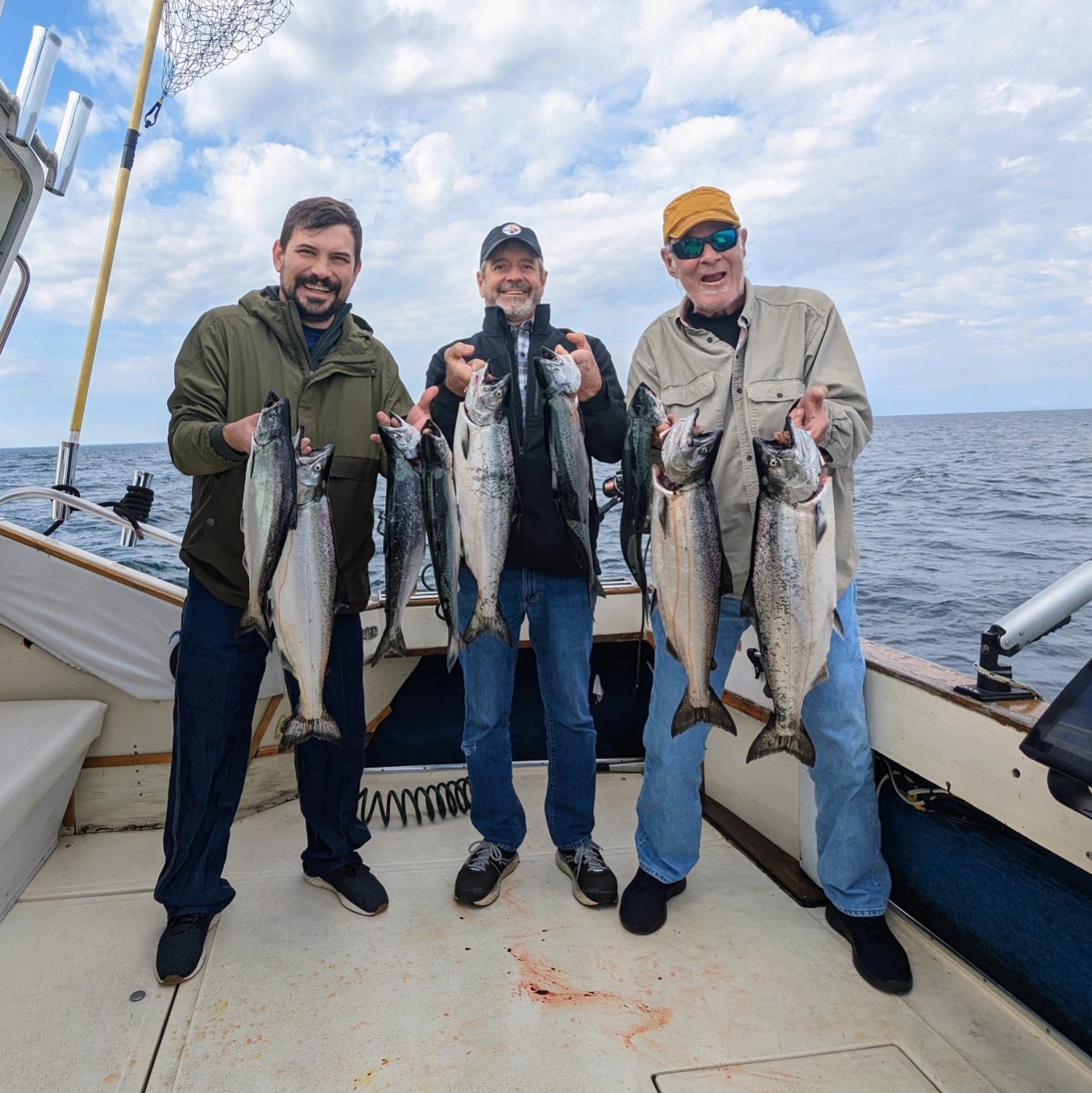 Group of 3 people fishing for 6 great barracuda, 22 inches long, at 200 Broadway Avenue