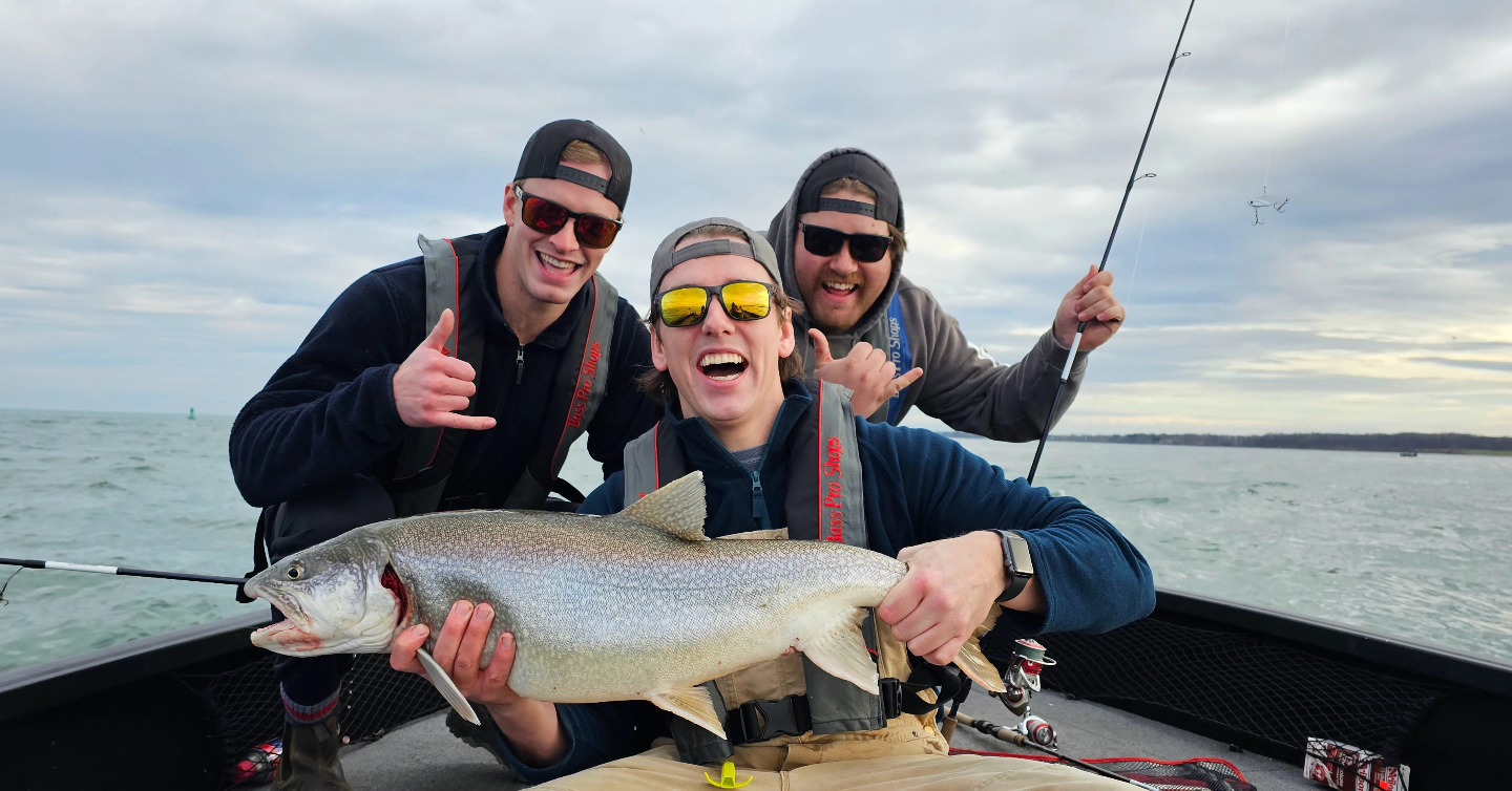 Three people fishing with rods on 200 Broadway Avenue