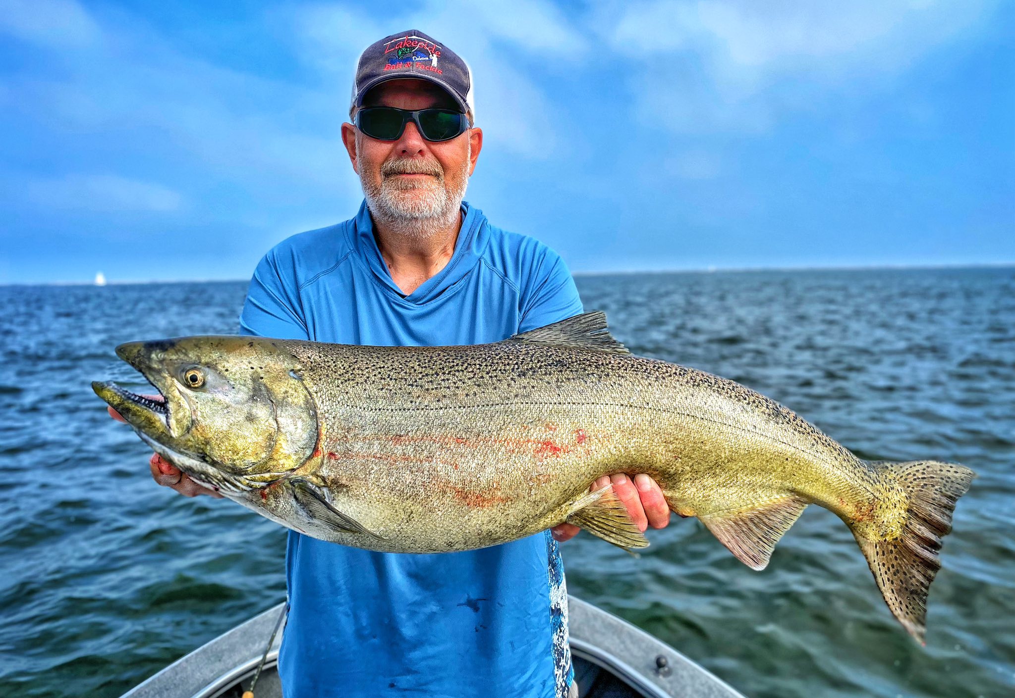 Photograph of a person fishing for a pink salmon in Arizona