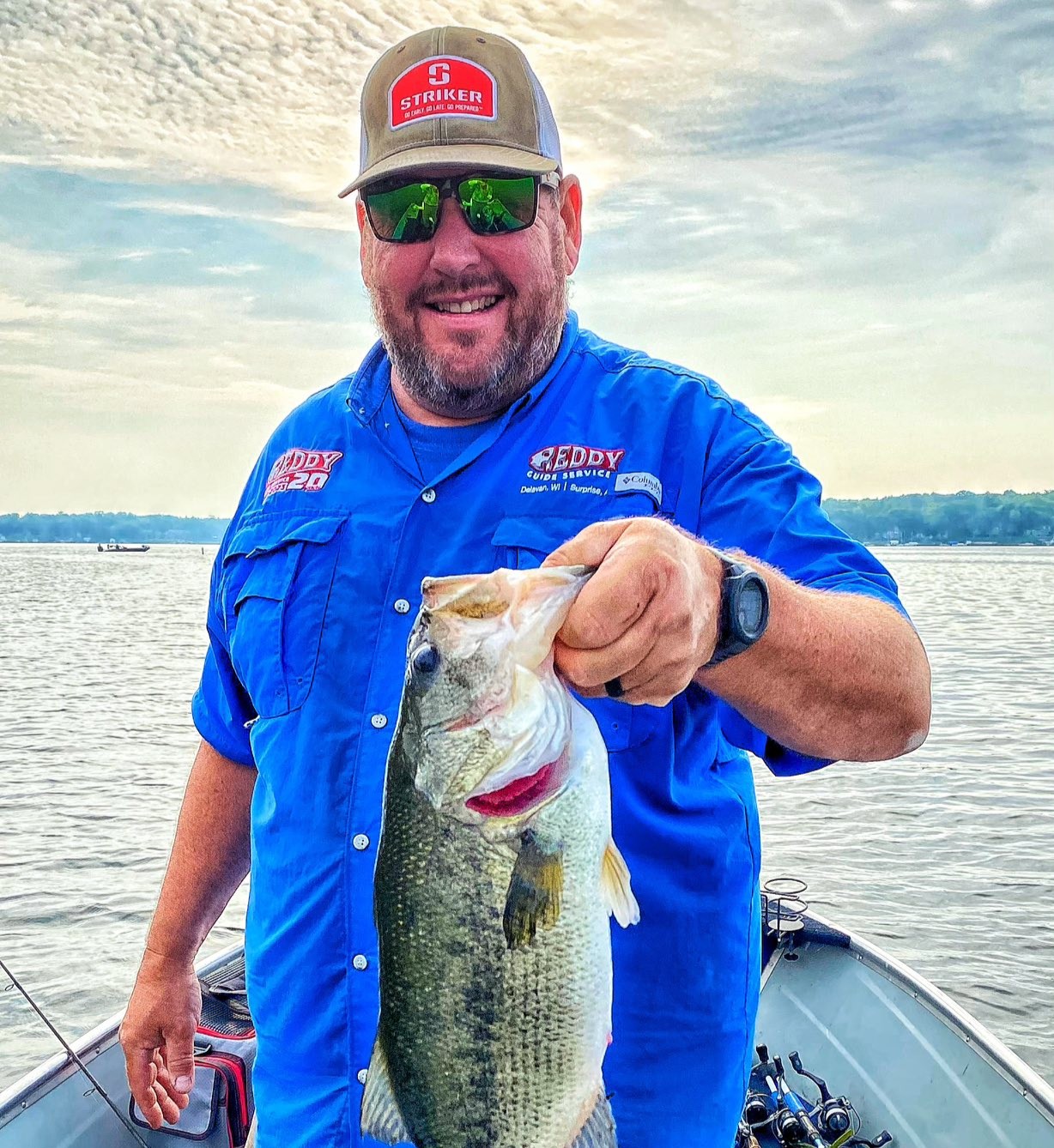 Bass boat on Lake Havasu with fishing gear ready for sunfish and bass fishing charter