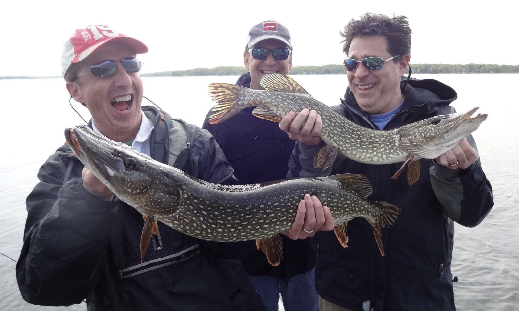 Fishing boat on Delavan or Geneva Lake with angler casting line during half day guided trip