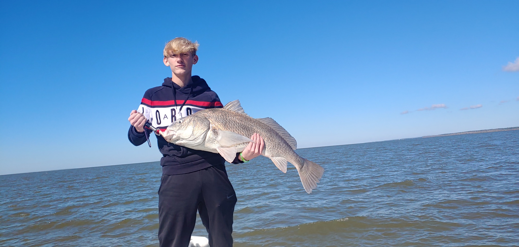 Angler holding a 28-inch fish in Alabama