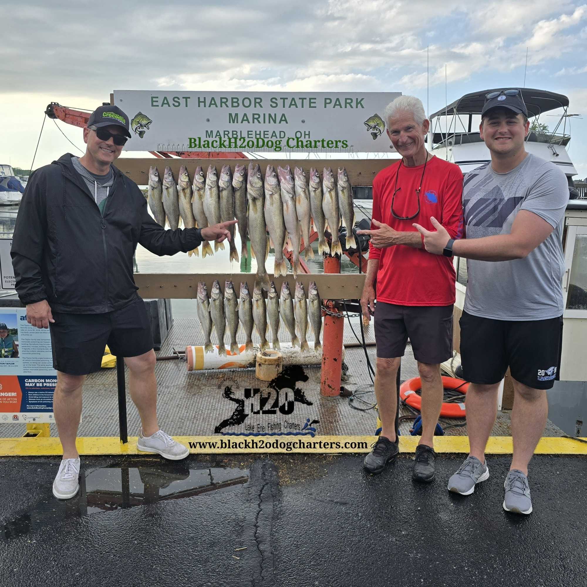 Successful walleye fishing charter displaying large catch at East Harbor State Park Marina in Lakeside Marblehead OH