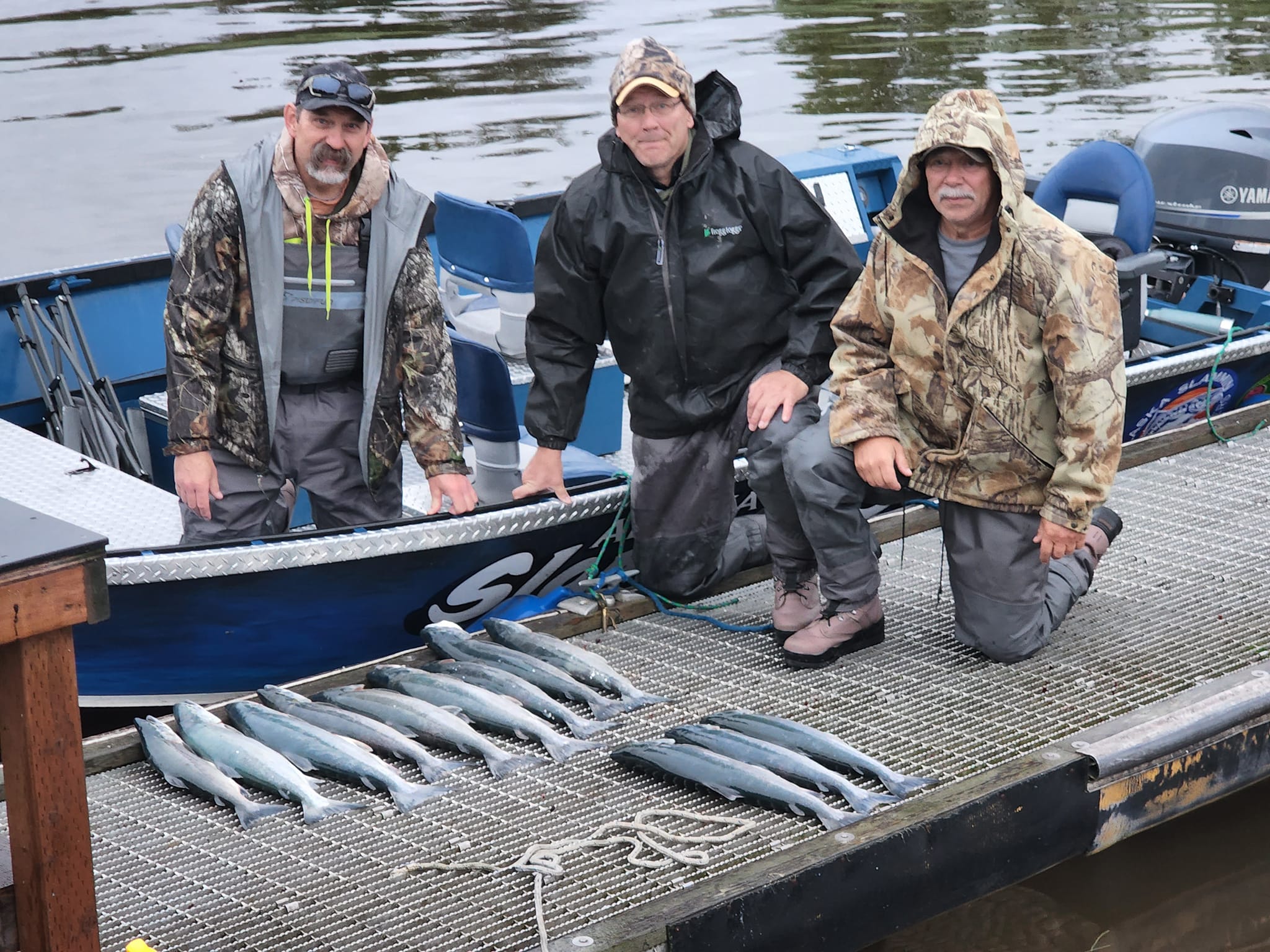 A group of 3 people fishing in AK