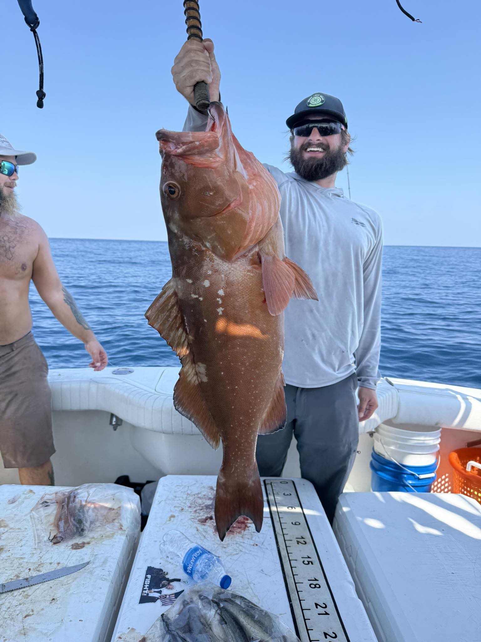 Red grouper caught deep sea fishing in Pensacola Beach FL displayed on boat deck