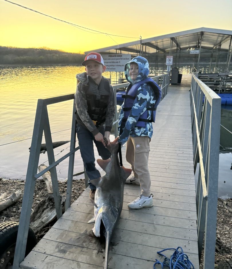 Two people fishing in Branson