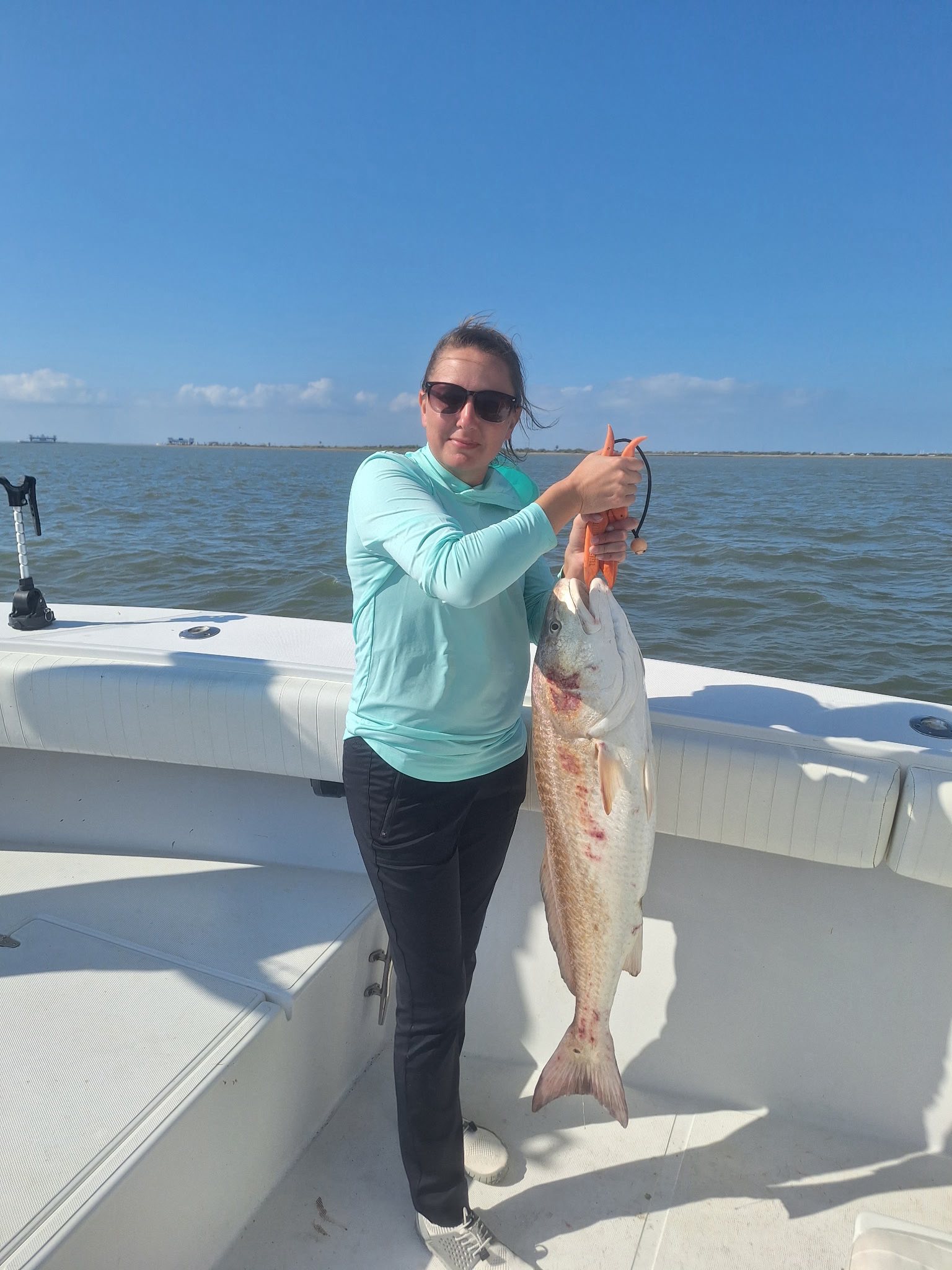 Fresh caught redfish displayed on fishing boat deck in Galveston TX waters