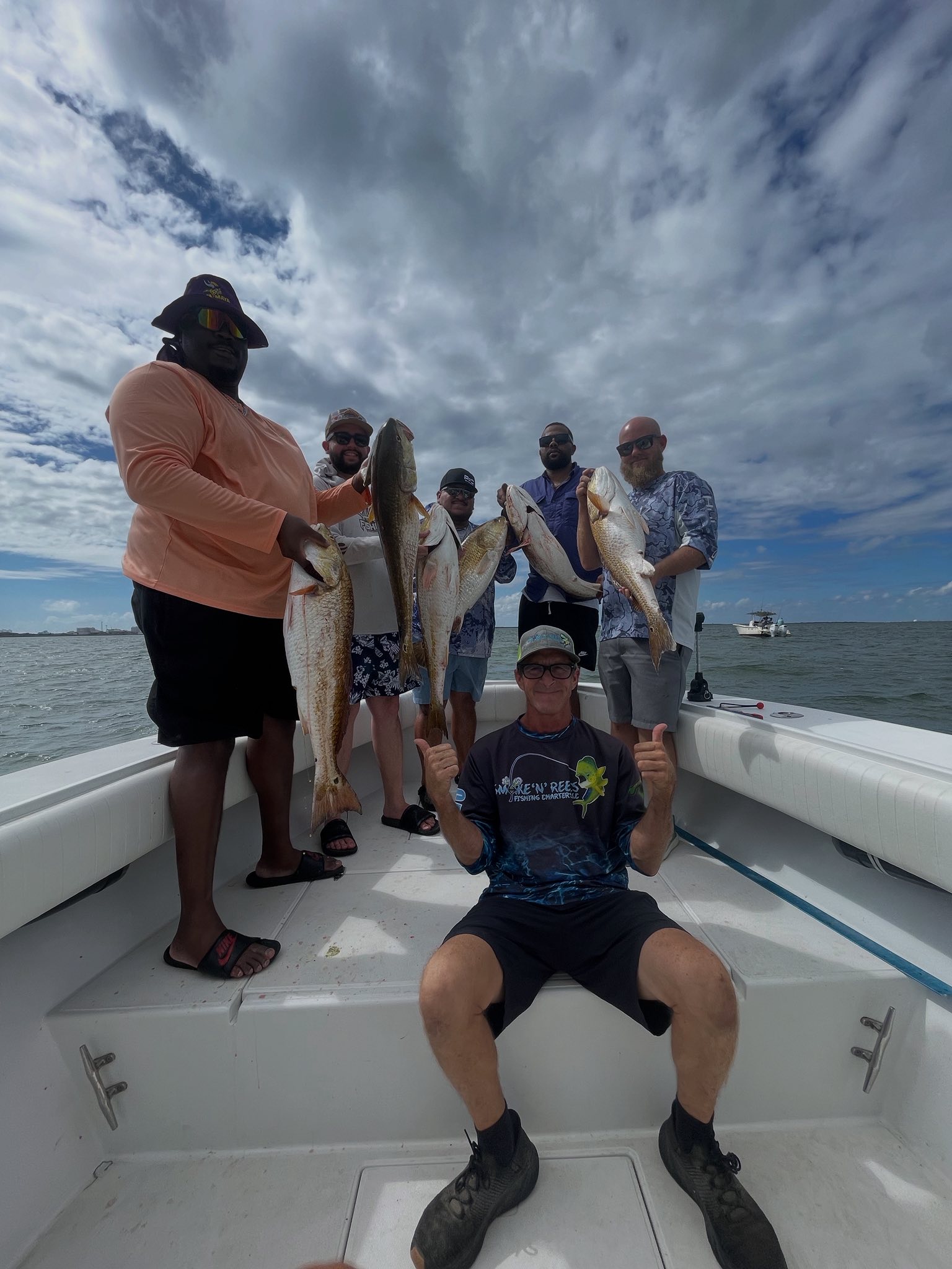 Successful redfish fishing trip with multiple redfish caught on boat