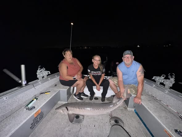 Lake sturgeon catch on fishing boat in Detroit MI at night