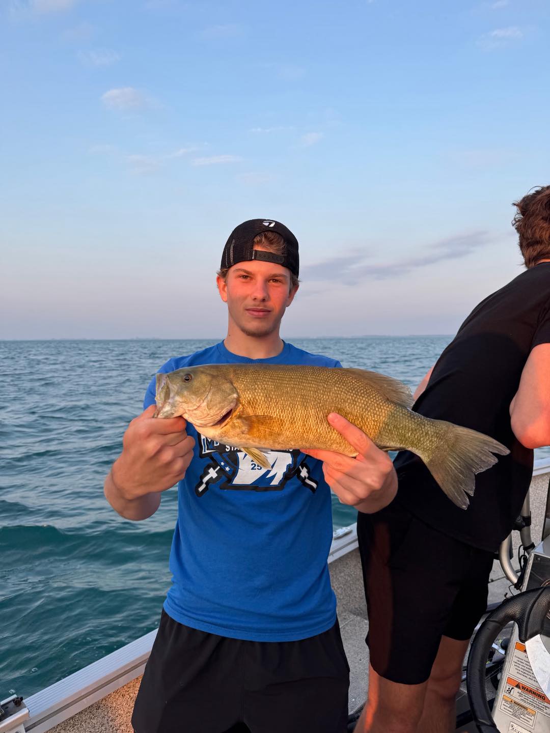 Smallmouth bass catch on fishing boat in Detroit MI waters