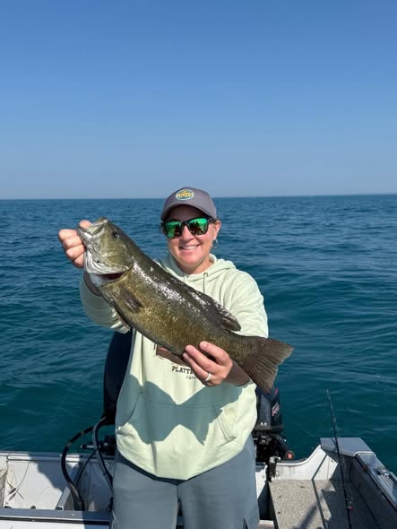 Smallmouth bass catch displayed on fishing boat in Detroit MI waters