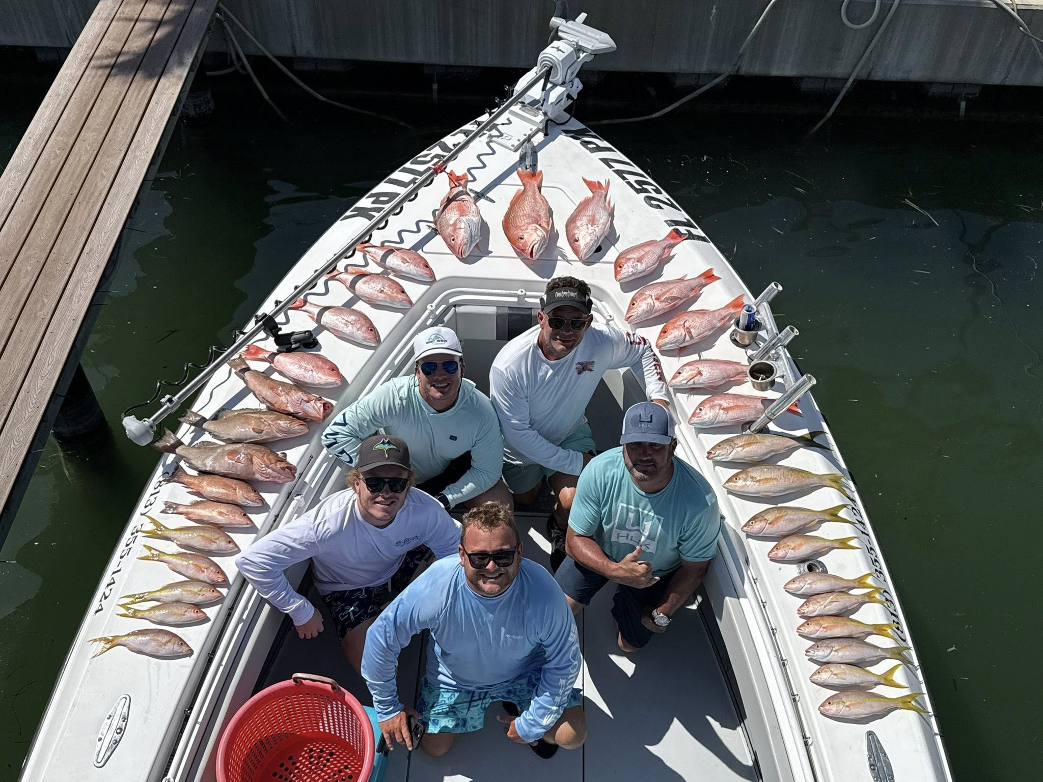 Red snapper fishing charter catch displayed on boat deck in Tierra Verde FL