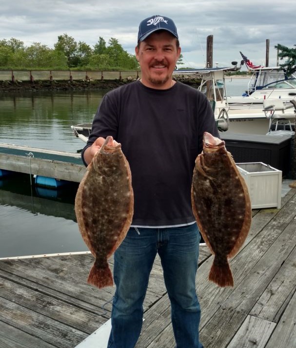 Two summer flounder fish caught in NY