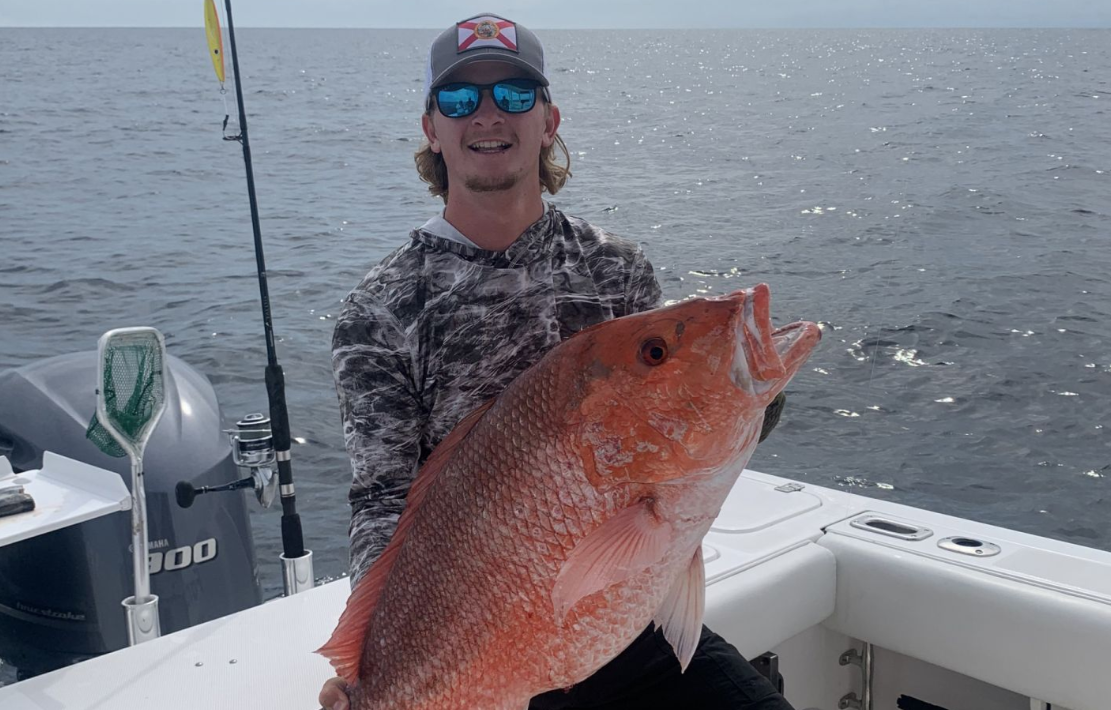 Angler with a single 19-inch fish in Destin