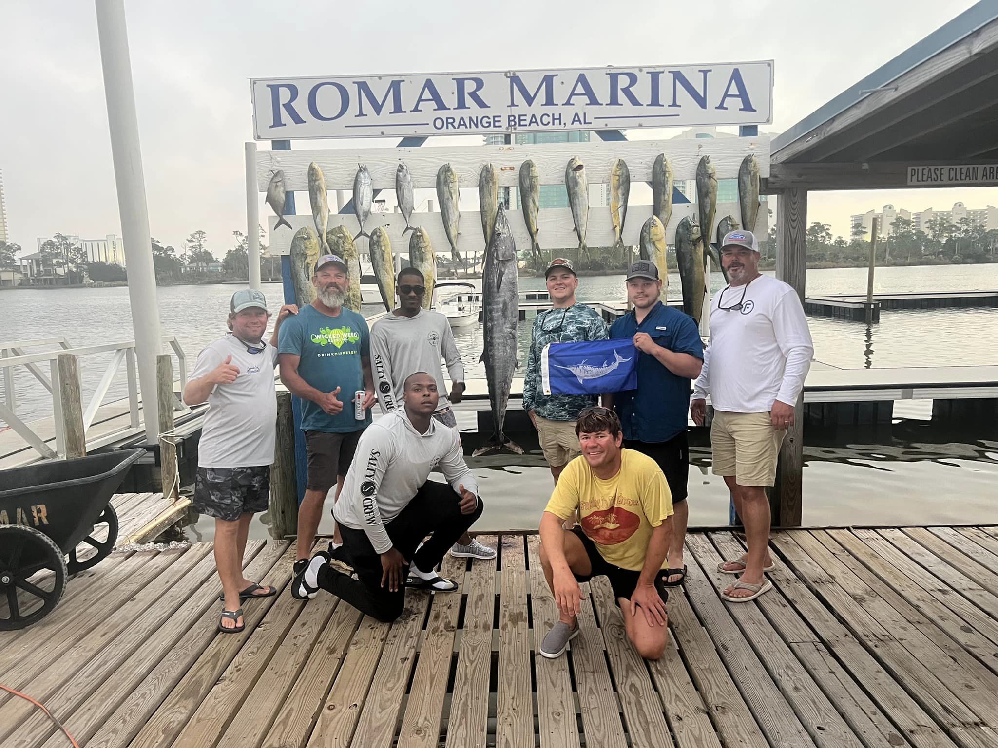 Group of 8 people fishing at Orange Beach