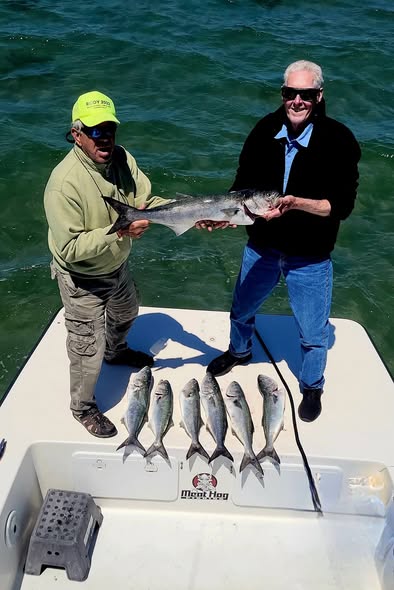 Beginner-friendly sport fishing charter boat in Wanchese, NC waters with fishing equipment ready