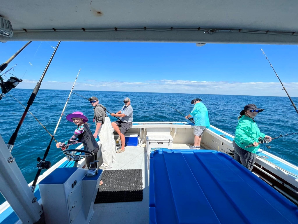 Three people enjoying the scenic view in Boothbay Harbor