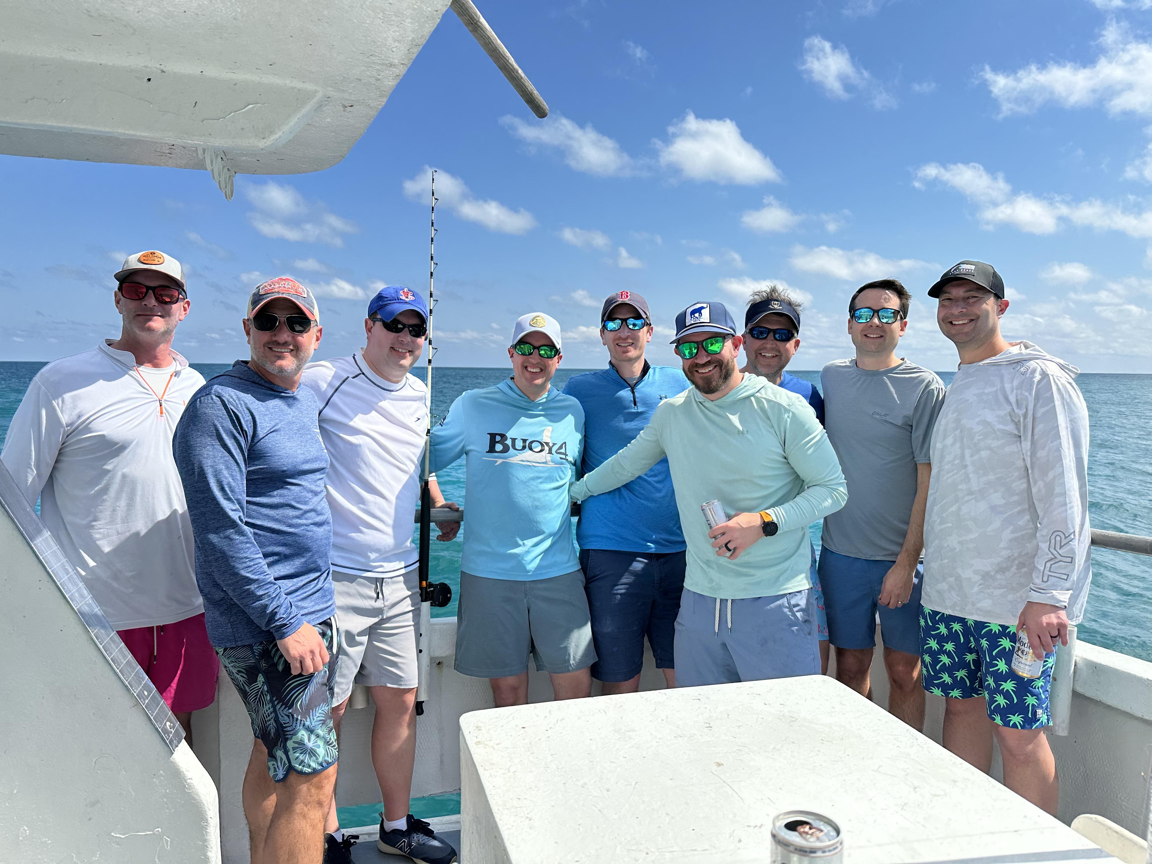9 people on a tour of Key West, enjoying cruises, fishing, and other activities.