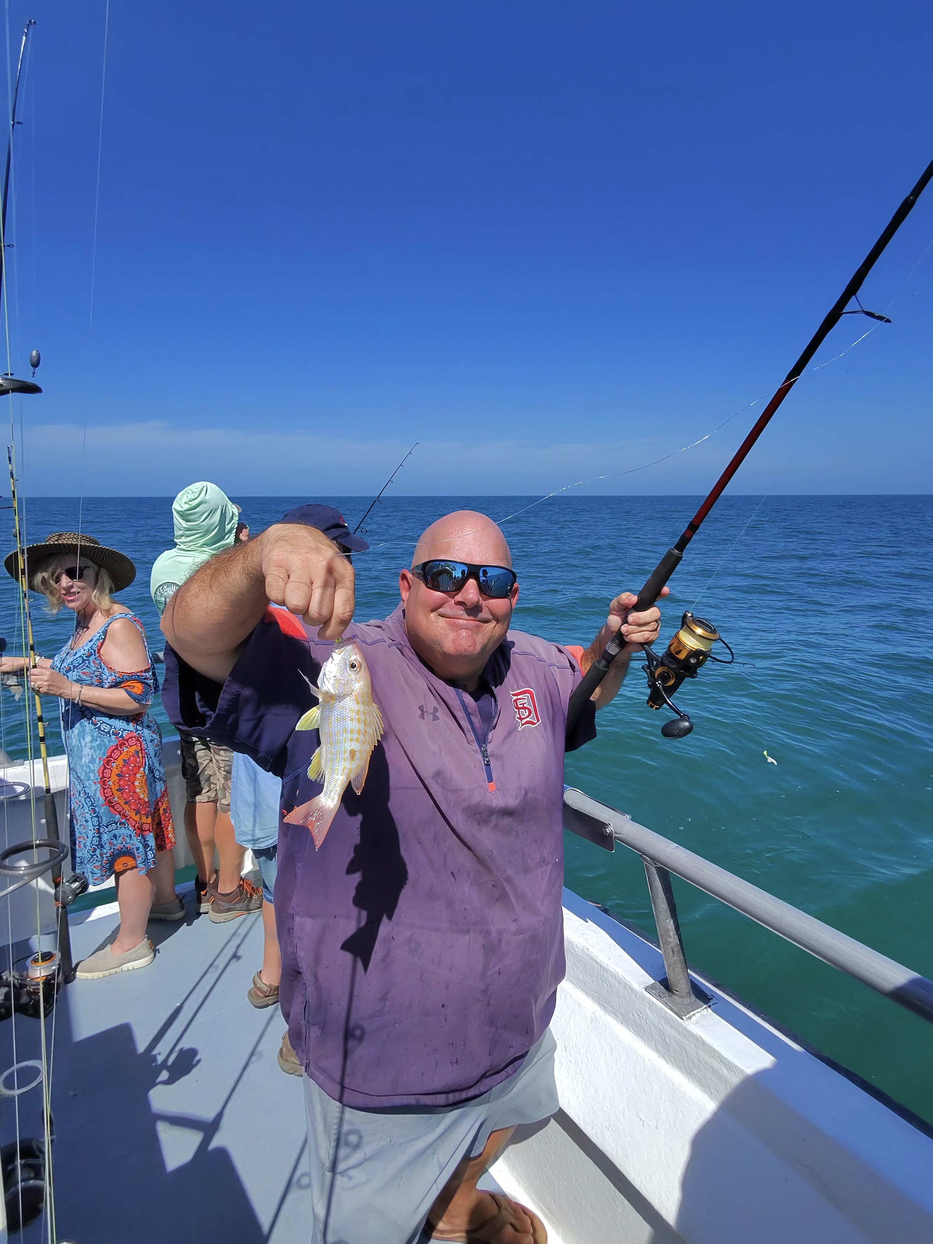 Two people enjoying a fishing tour in Key West