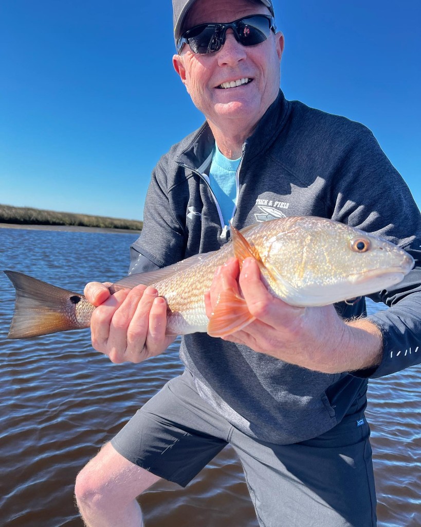Angler with a 13-inch fish in Dubois