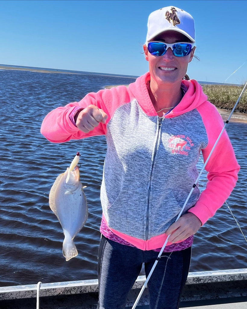 Angler posing with a 10-inch fish in Dubois