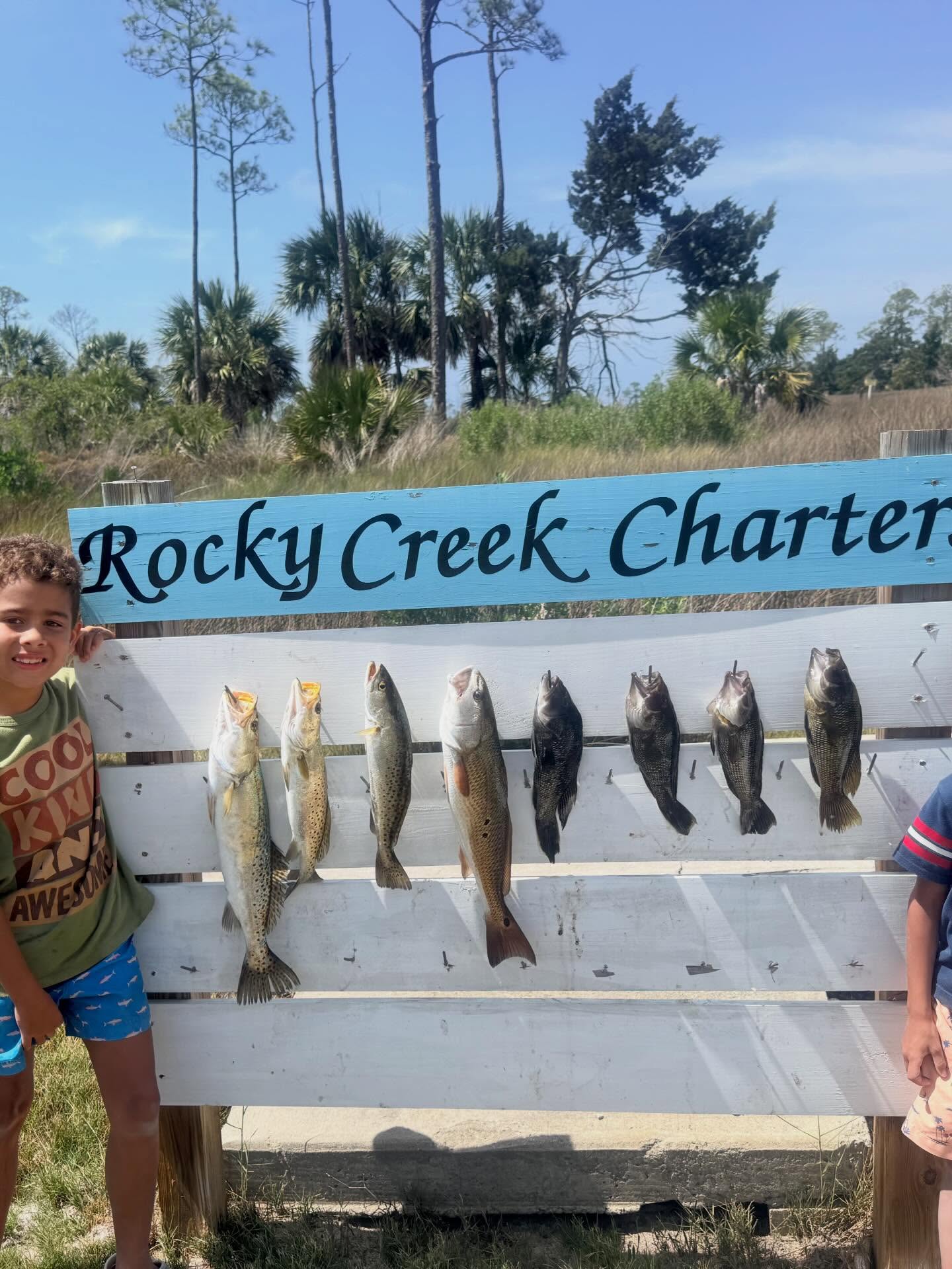 Eight fish catch displayed on Rocky Creek Charter cleaning station in Steinhatchee FL including redfish, speckled trout, and black sea bass