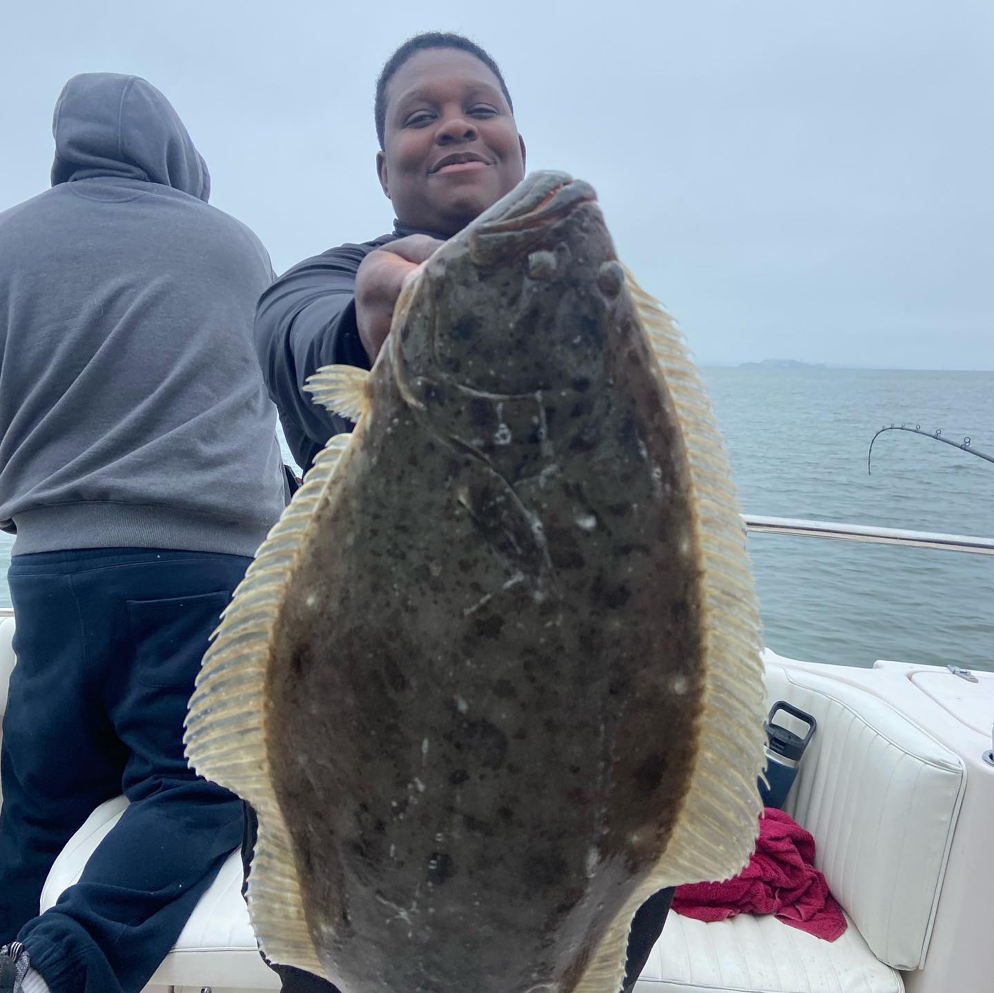 Angler holding a 26-inch fish in Pittsburg