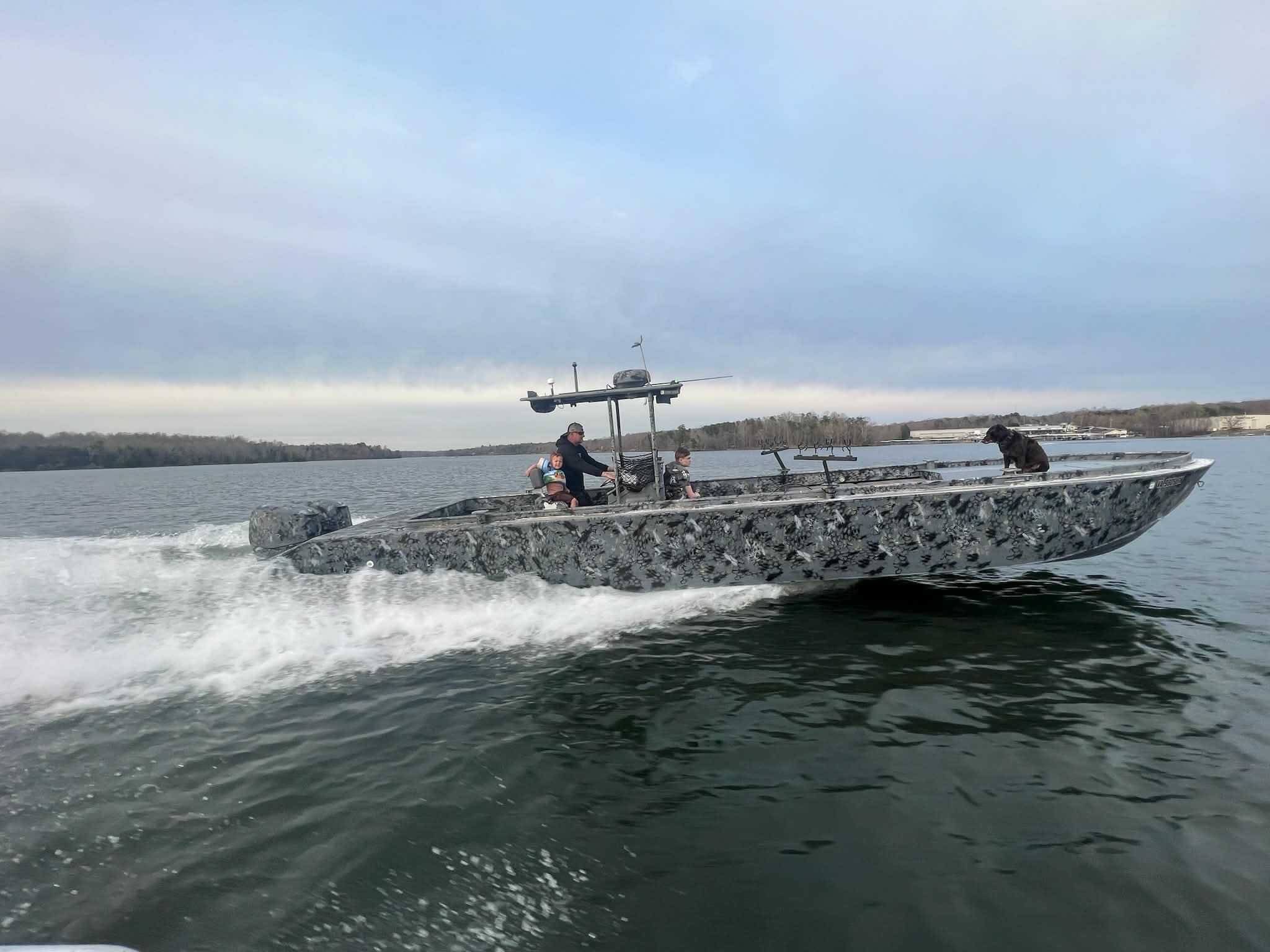 Guided duck hunting charter boat on Lake Erie with decoys and hunting gear setup