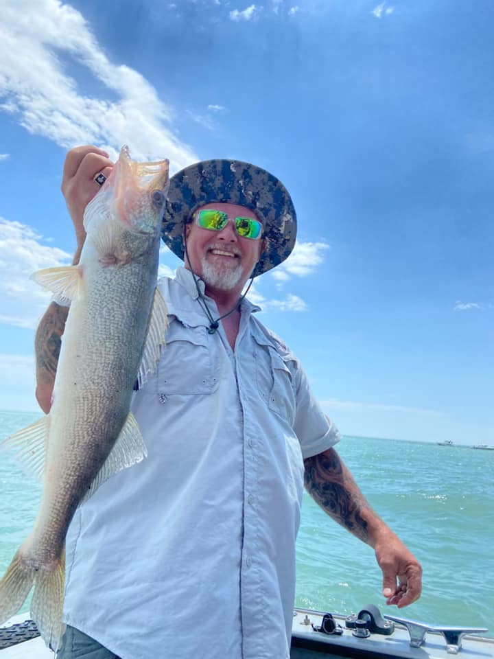 Angler with a big fish caught in Port Clinton