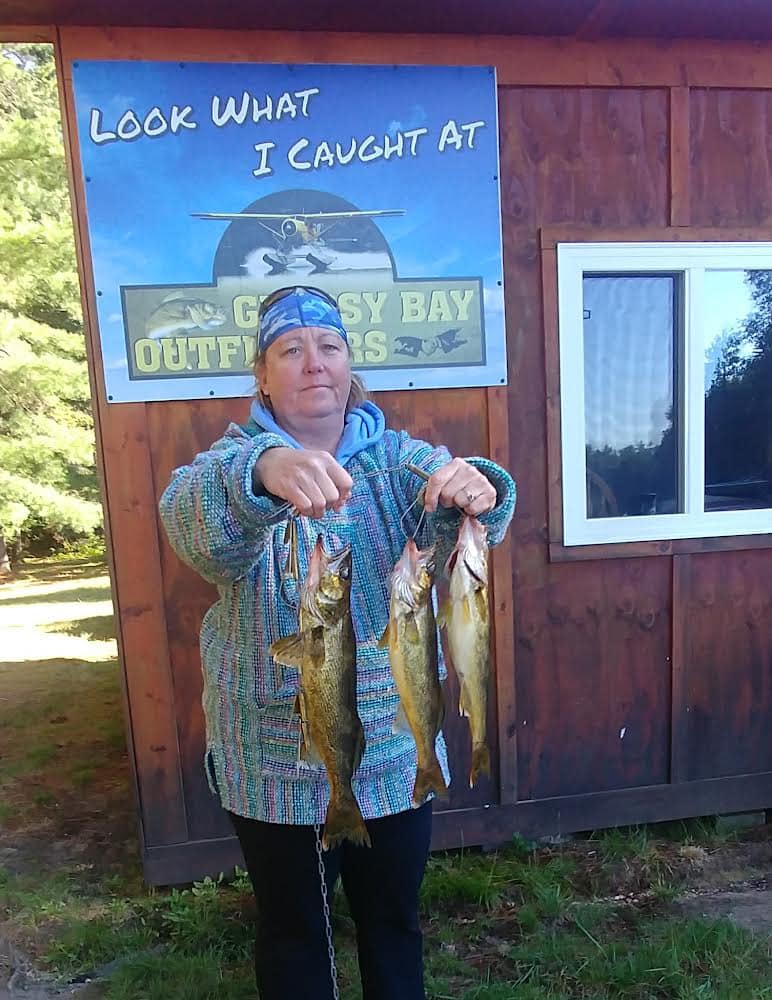 Three impressive fish caught during a fishing tour in Elliot Lake