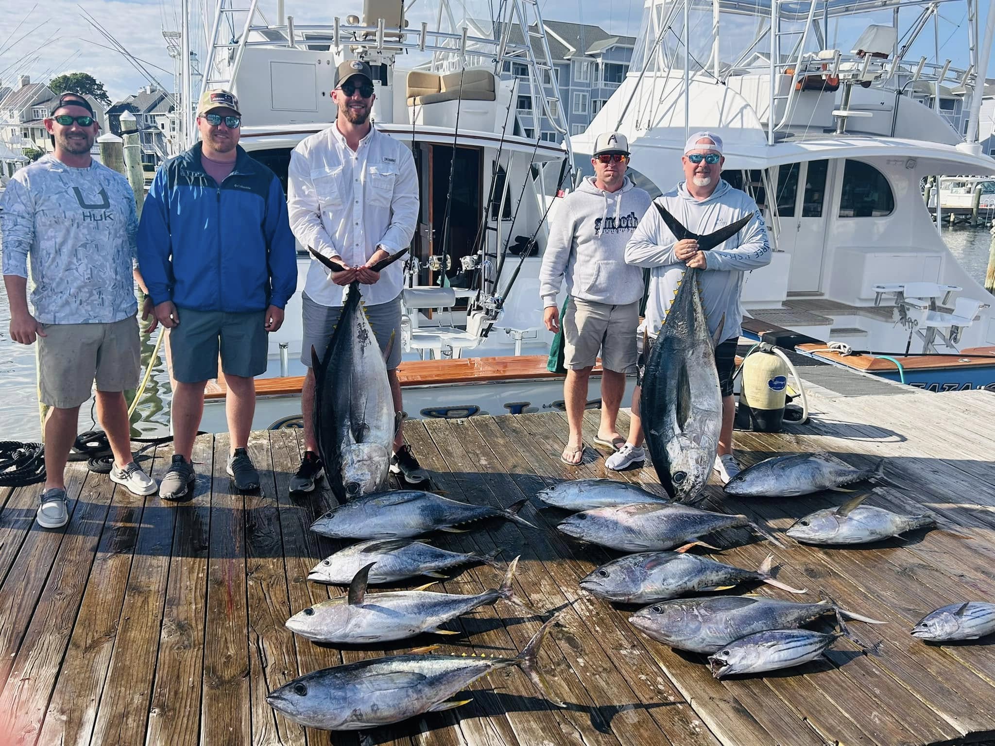 Successful tuna fishing charter in Manteo NC with yellowfin tuna, bluefin tuna, and skipjack tuna displayed on dock