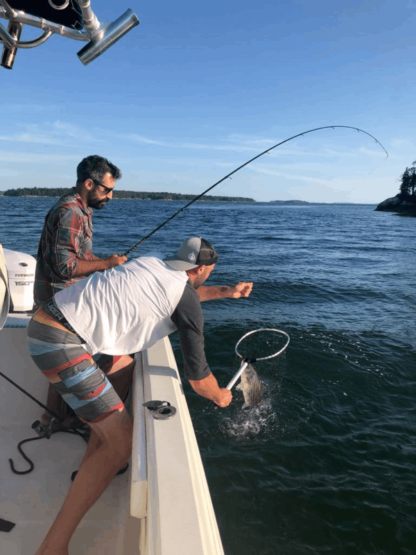 Two people fishing in Maine