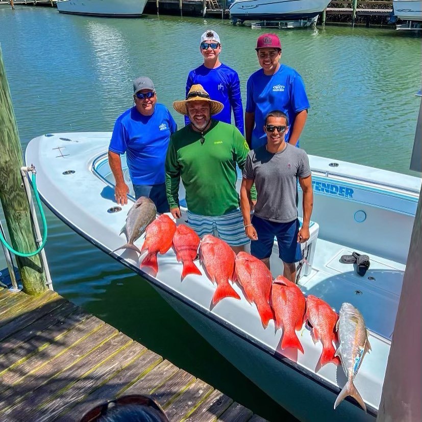 Anglers enjoying a successful fishing trip in FL with 6 big fish