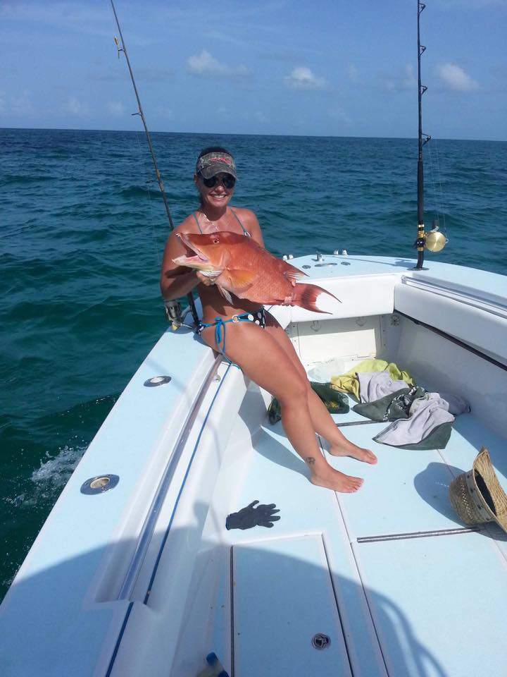 Proud angler posing with 21-inch catch in Fort Pierce