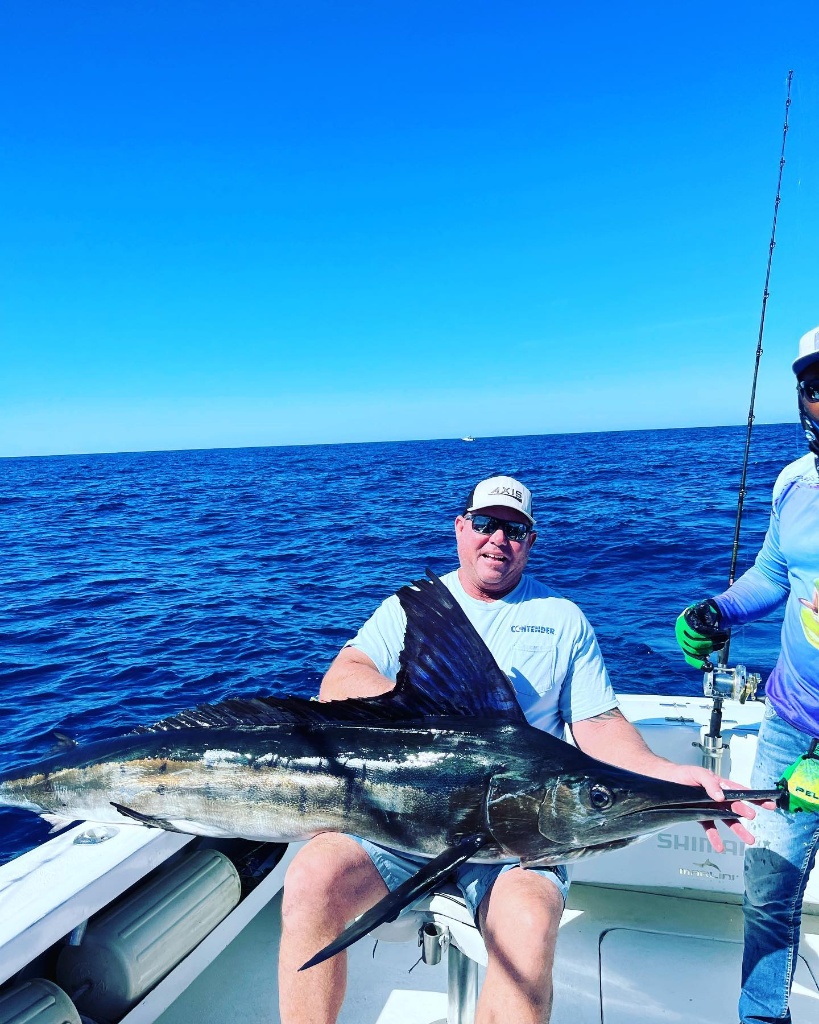 Angler with a 48-inch fish at Fort Pierce
