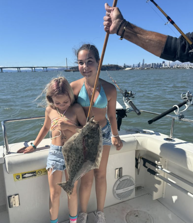 A group of 3 people fishing in San Francisco