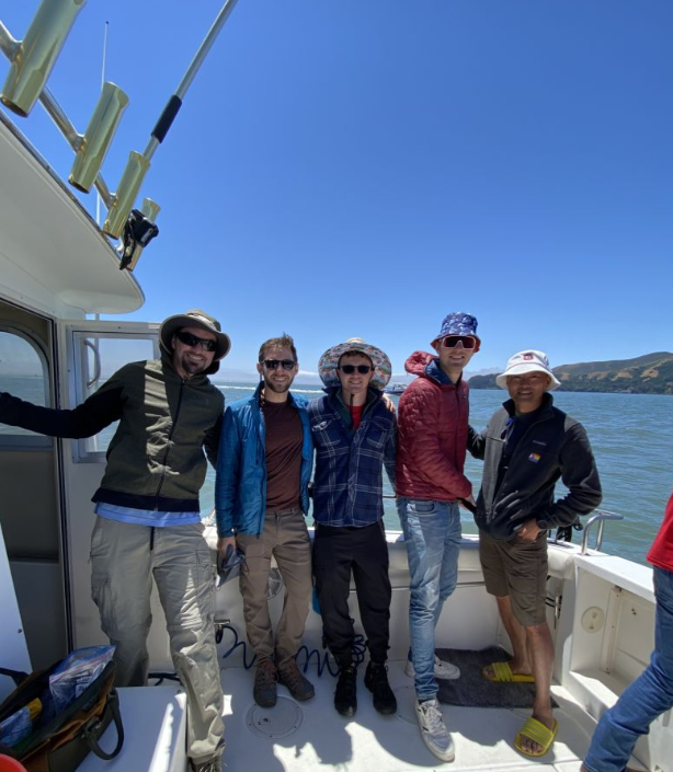 Five people fishing on the coast of CA