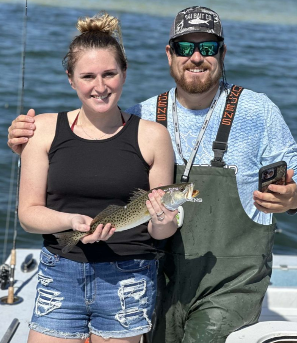 A couple enjoying fishing on the beach in Bradenton Beach