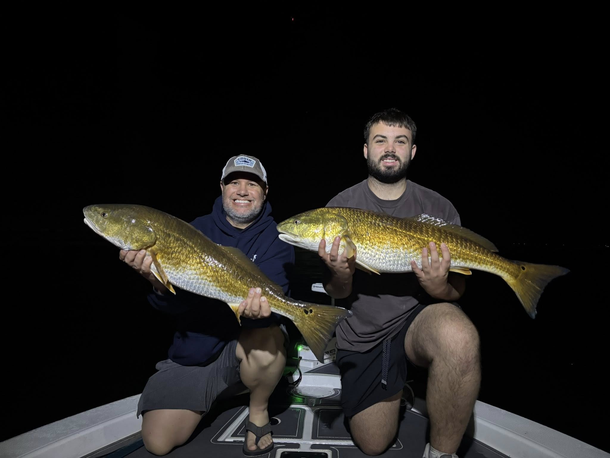 Two anglers with a couple of redfish in Milton