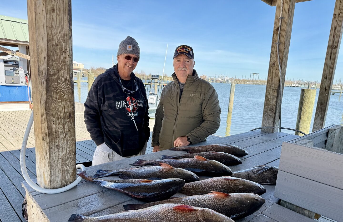 Fresh caught redfish displayed on dock table at Venice LA marina