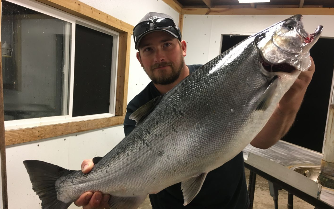 Lone fisherman in North Muskegon enjoying cruises and fishing adventures